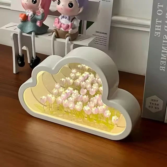 Cloud Tulip Infinity Night Light with delicate tulips in a cloud design, glowing softly on a wooden table.